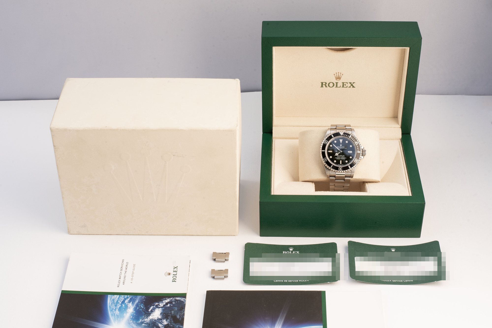 Rolex Sea-Dweller 16600 met complete set: doos, papieren en garantiekaarten